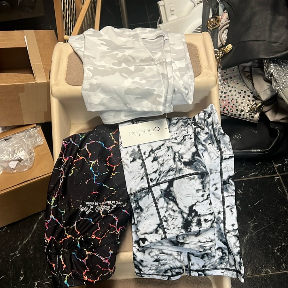 Theee pairs of workout pants not worn.